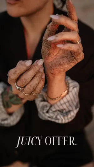 One of Meg's Instagram Stories: sandy hands with the words Juicy Offer